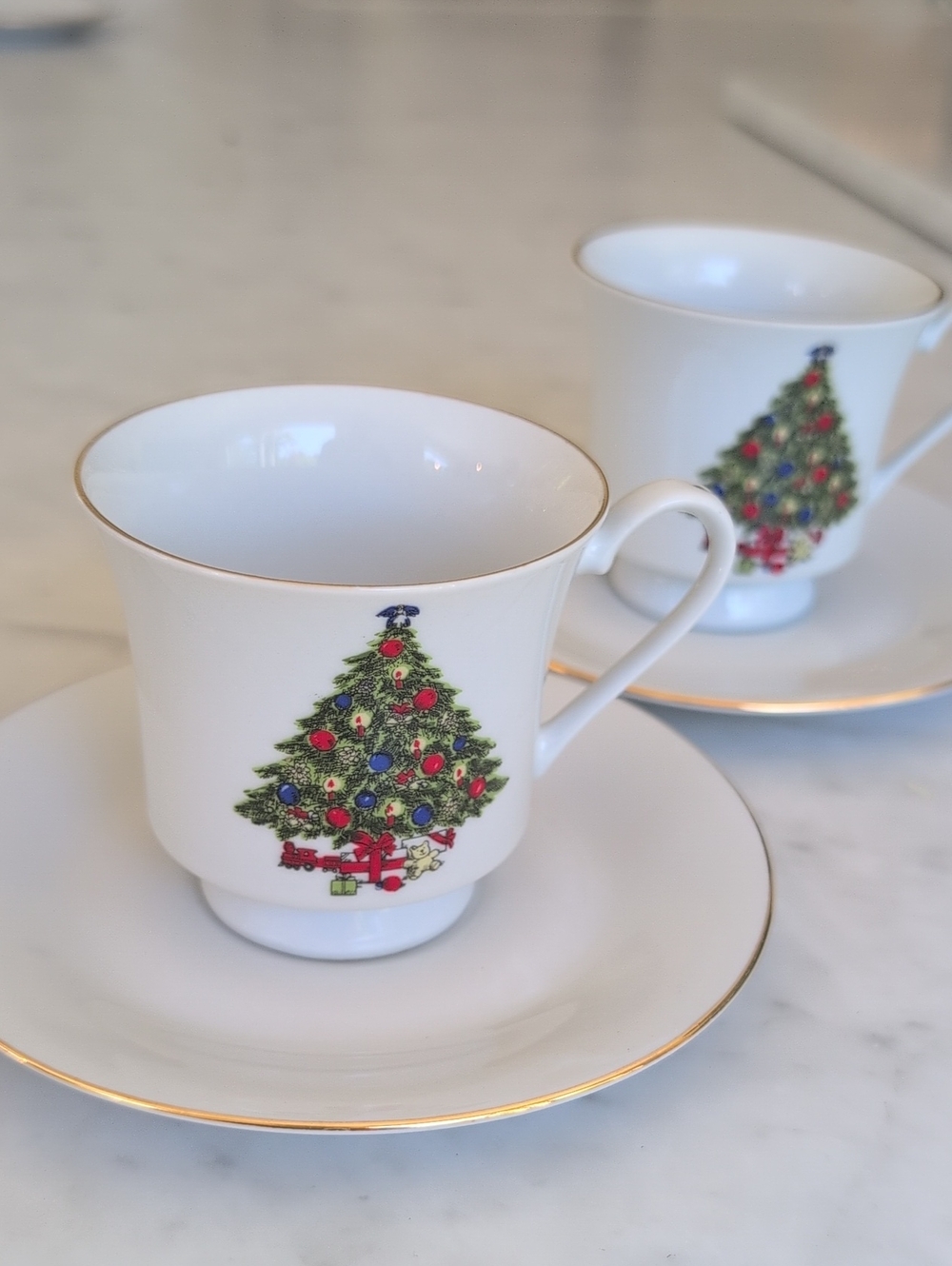 Two Classic White Christmas Teacup And Saucer Sets